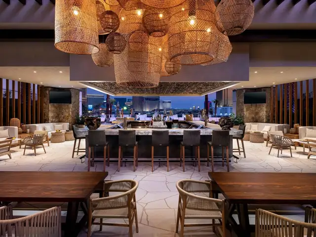 Conrad Las Vegas at Resorts World, modern bar area with a city view