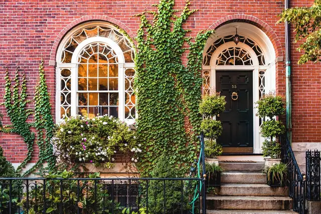 Four Seasons in Boston, brick building with arched windows and a black door