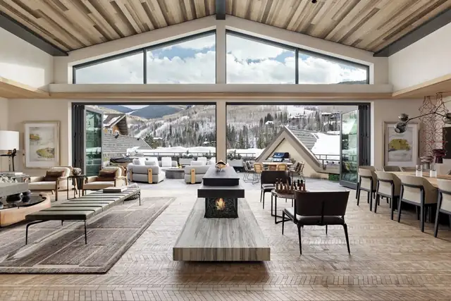 Four Seasons Resort Vail in Vail, spacious lounge with a fireplace