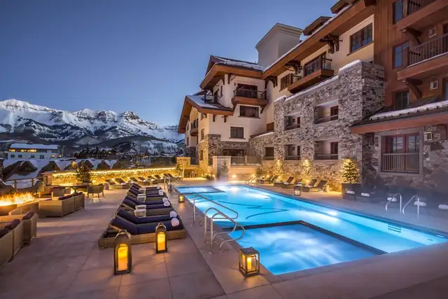 Madeline Hotel in Telluride, pool area with lounge chairs and mountain view