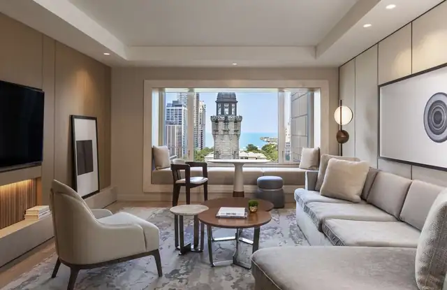 Park Hyatt Chicago in Chicago, modern living room with a sofa, armchairs and TV