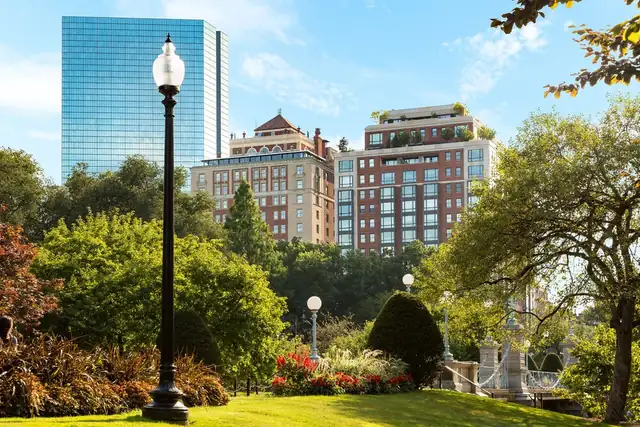The Newbury in Boston, park with a lamp post, a bridge and buildings behind