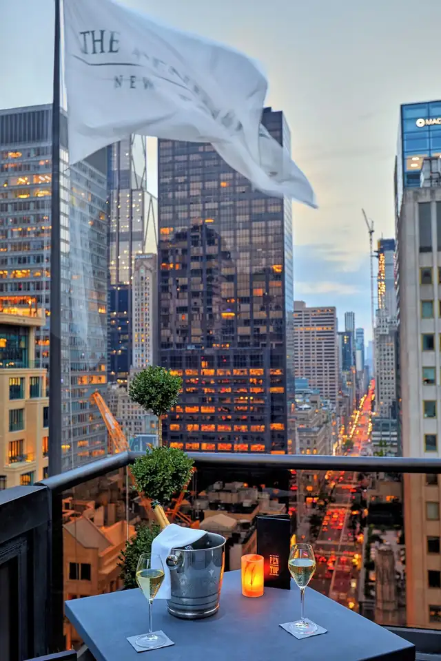 The Peninsula in New York, table with champagne, glasses and a menu
