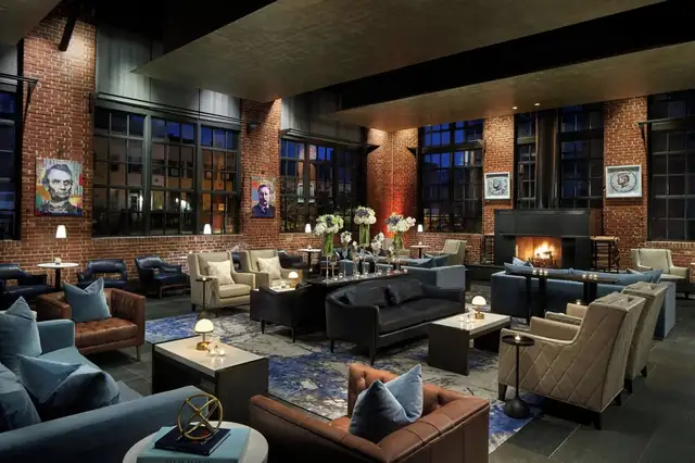 Ritz-Carlton Georgetown in Washington DC, lounge with leather sofas, armchairs and a fireplace