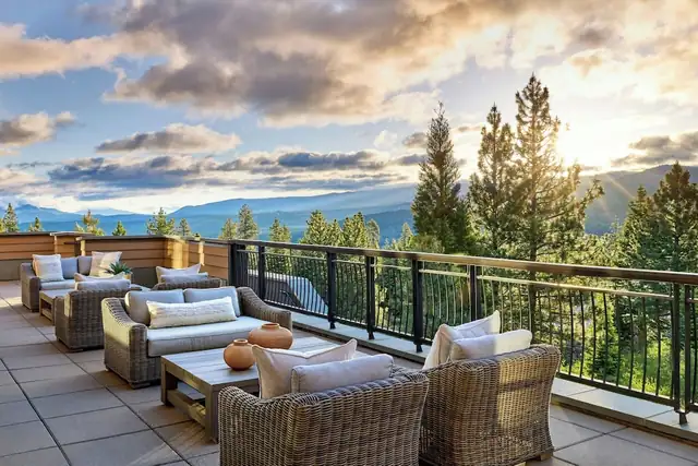 Ritz-Carlton Lake Tahoe in Truckee, balcony with wicker furniture and a railing